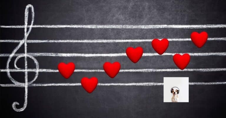 Musical staff written in chalk on a blackboard with red hearts for notes and a dog listening to music. Phonological activities help with learning to read.