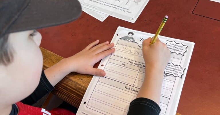 Child filling out a graphic organizer as he prepares to write. My child needs help in writing means many things.